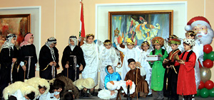 A group of students presenting a sketch to entertain the elderly.