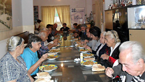 A group of elderly from JMP–L’s Old People’s Program having lunch, during their visit to the “Les Restaurants Du Coeur” Center.