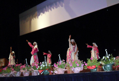 The folk dance group Alhan entertains the attendees of the event.
