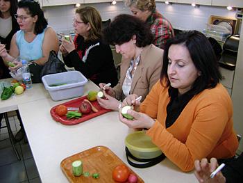 Participants practice decoration of dishes in the kitchen of the Mesrobian Technical College.